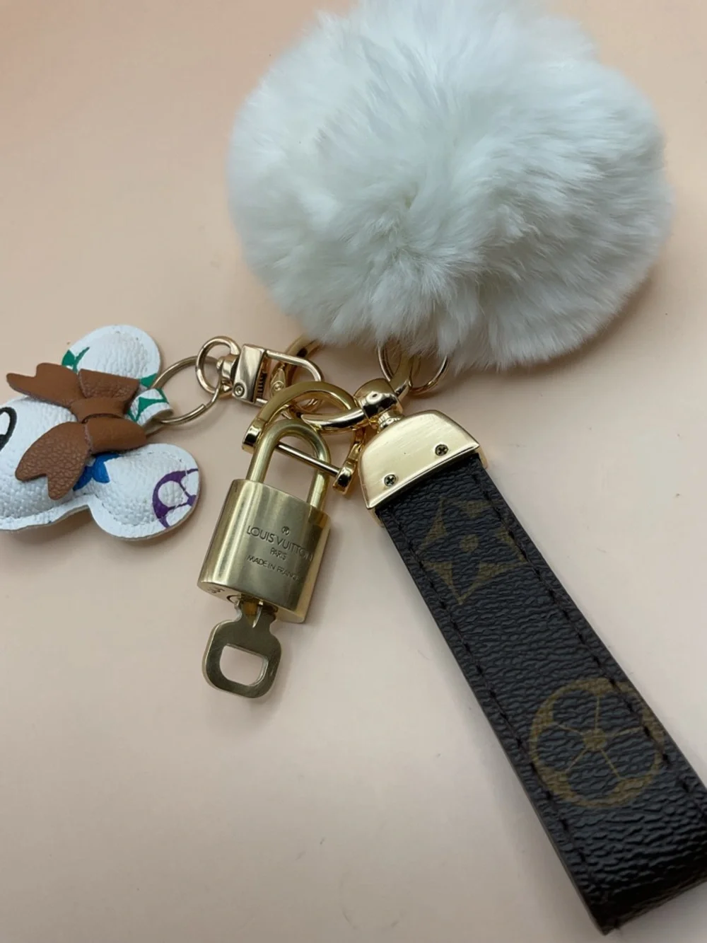 Monogram Leather Strap Keychain with Louis Vuitton Gold Lock and White Pom Pom - Picture 2 of 5